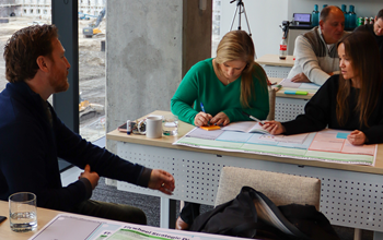 Business Executives at a collaborative workshop