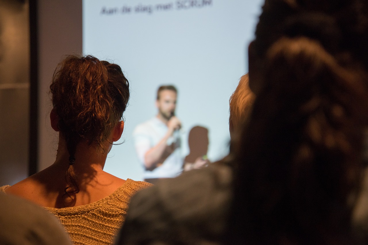 A presenter on stage