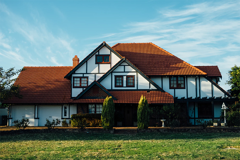 Our example image of a large white and brown house.