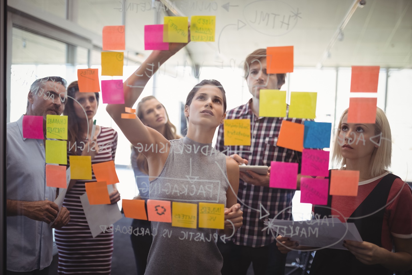 Group of people brainstorming with sticky notes