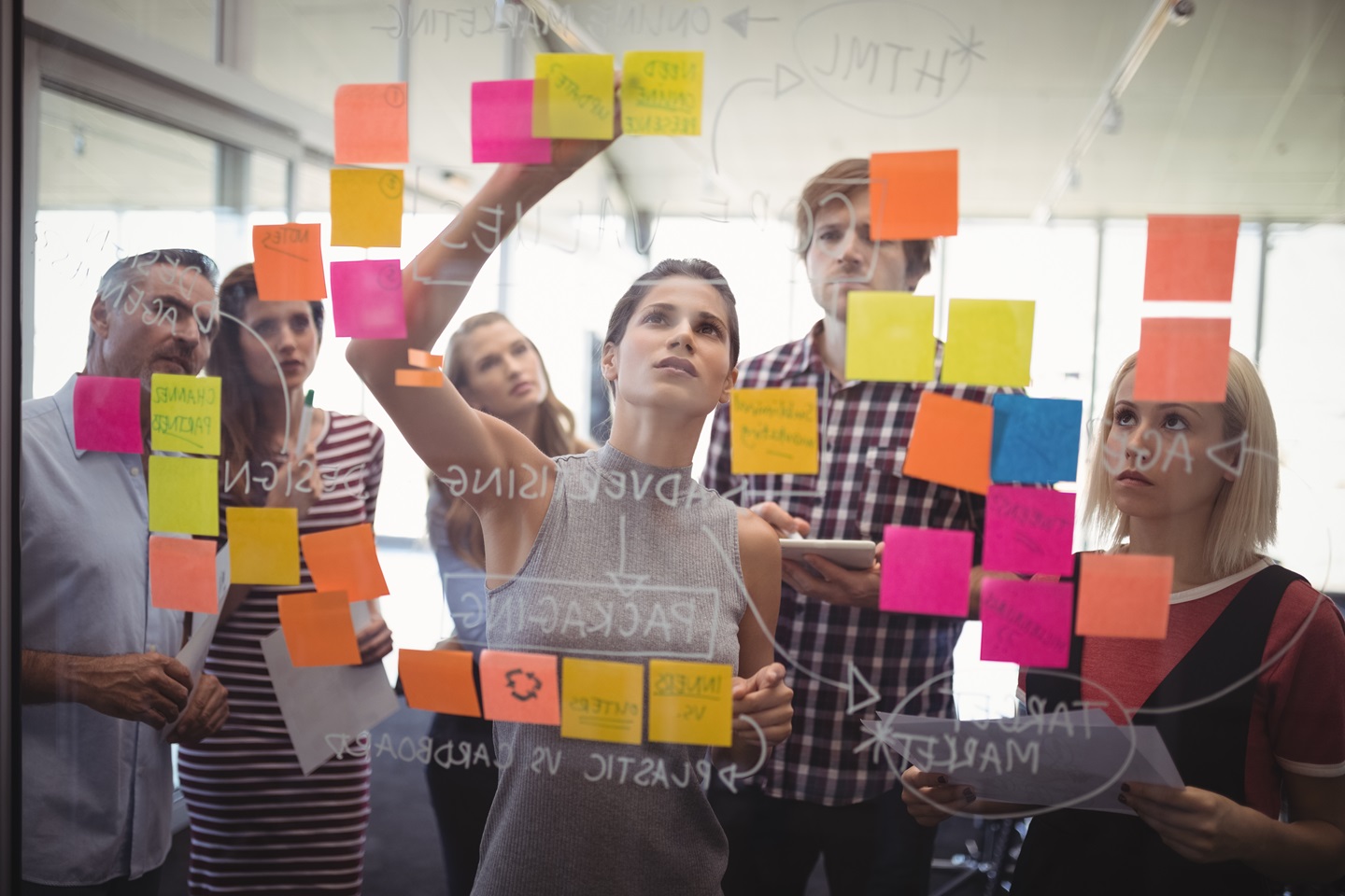 Group of people brainstorming with sticky notes