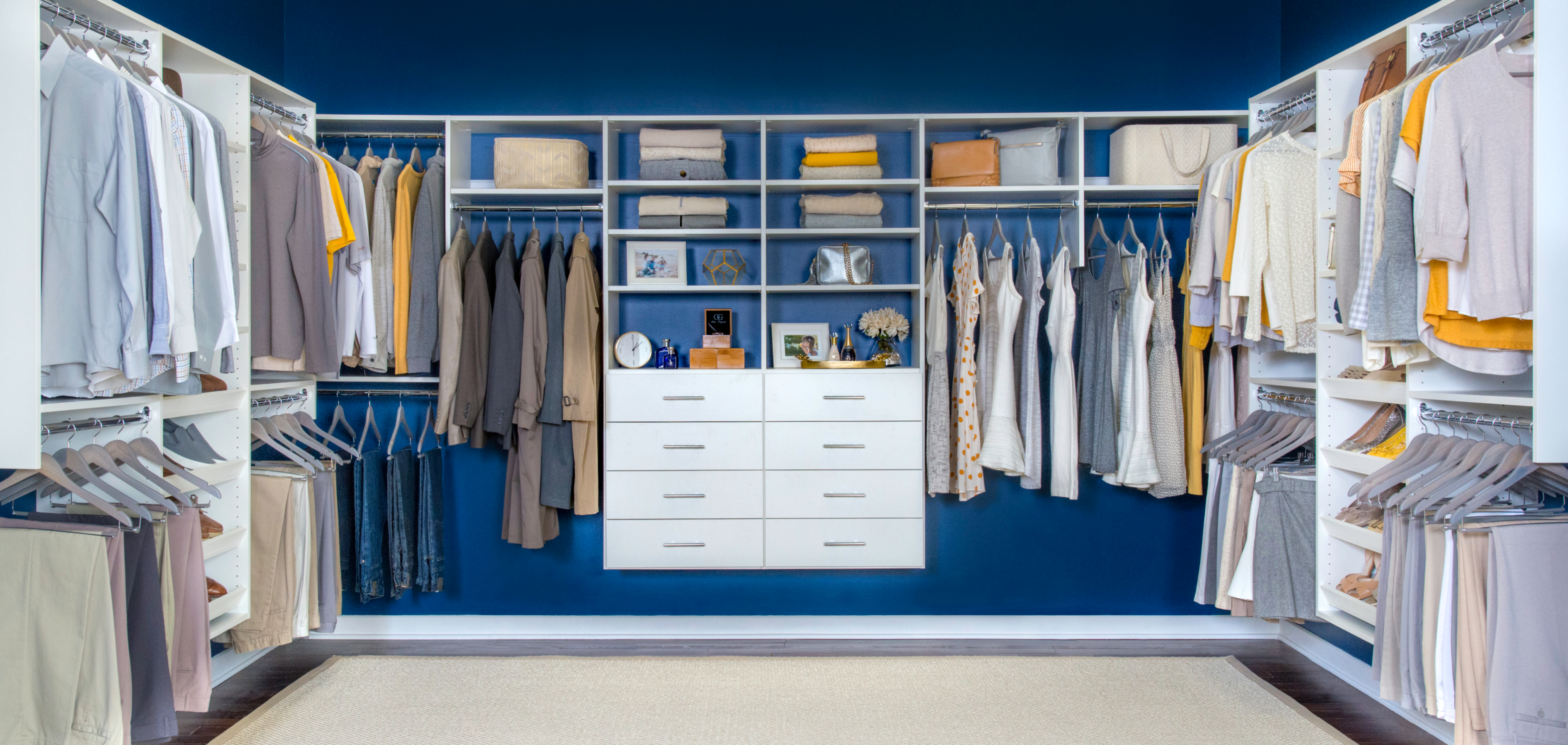 Walk in closet neatly organized